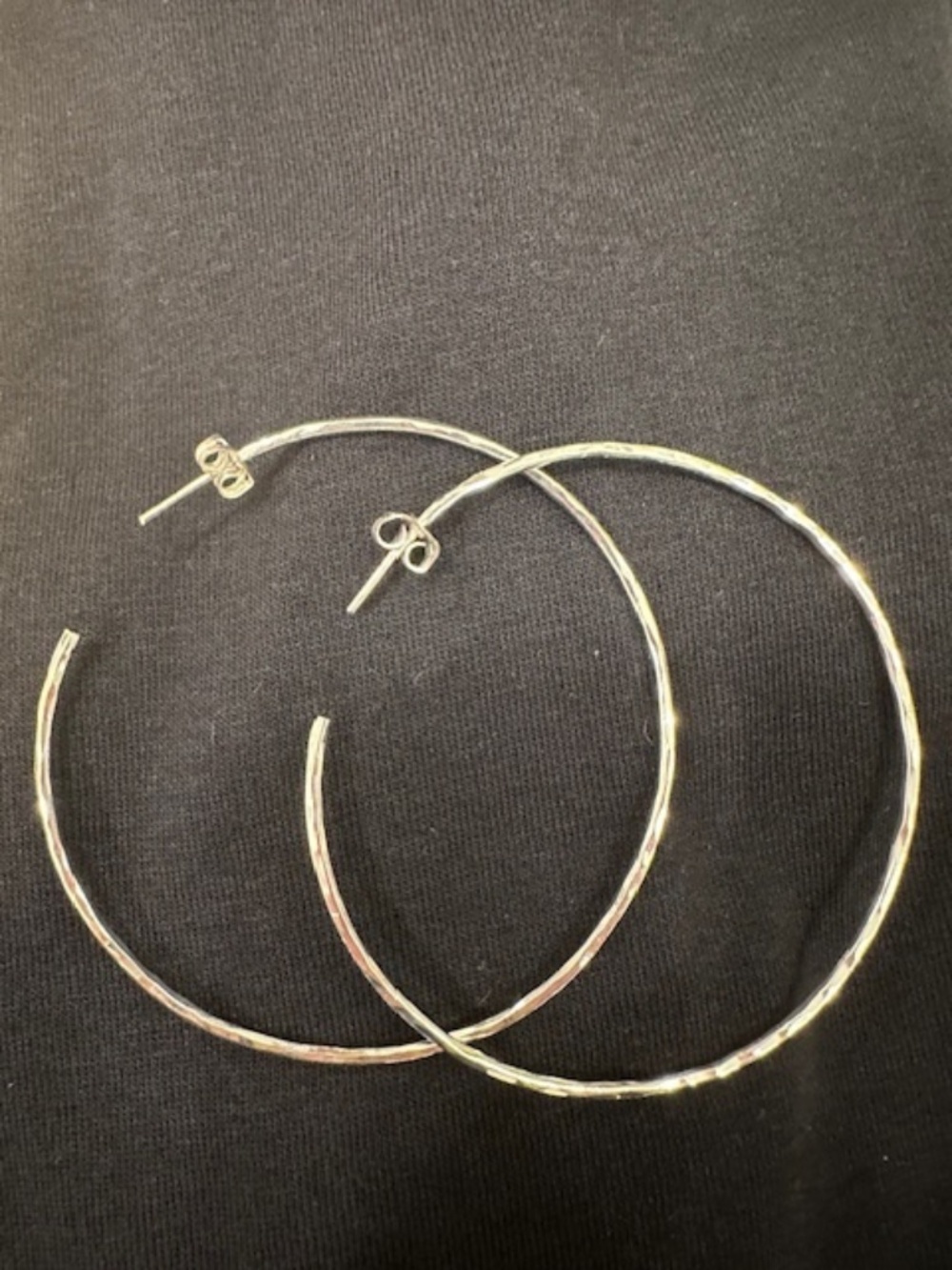 Large hoop sterling silver earrings.